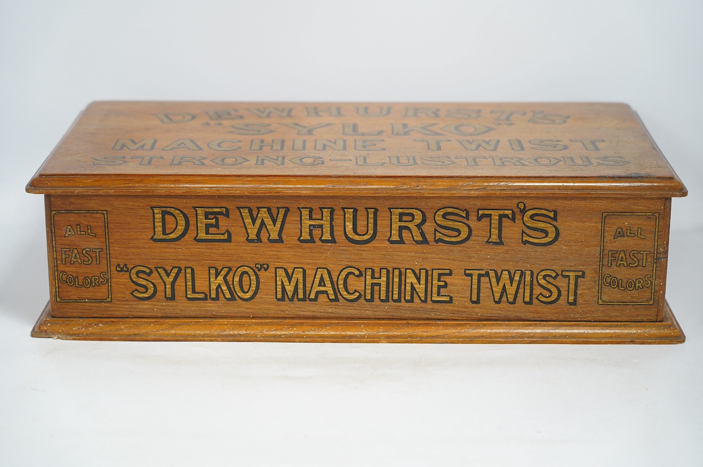 A mid 20th century Dewhurst's Sylko oak two drawer table top retail chest, 51cm wide, 14cm high. Condition - good